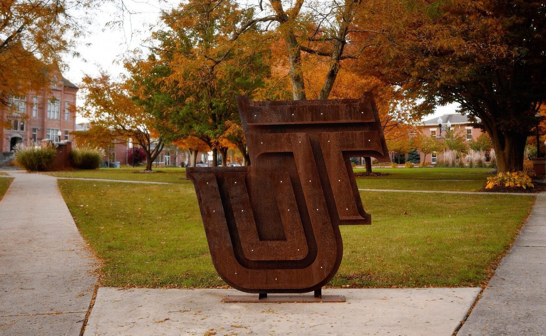metal tu logo outside in fall