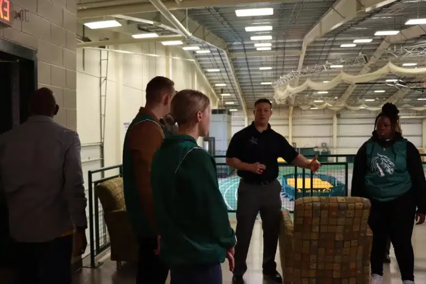 male instructor talking with students at secret service event